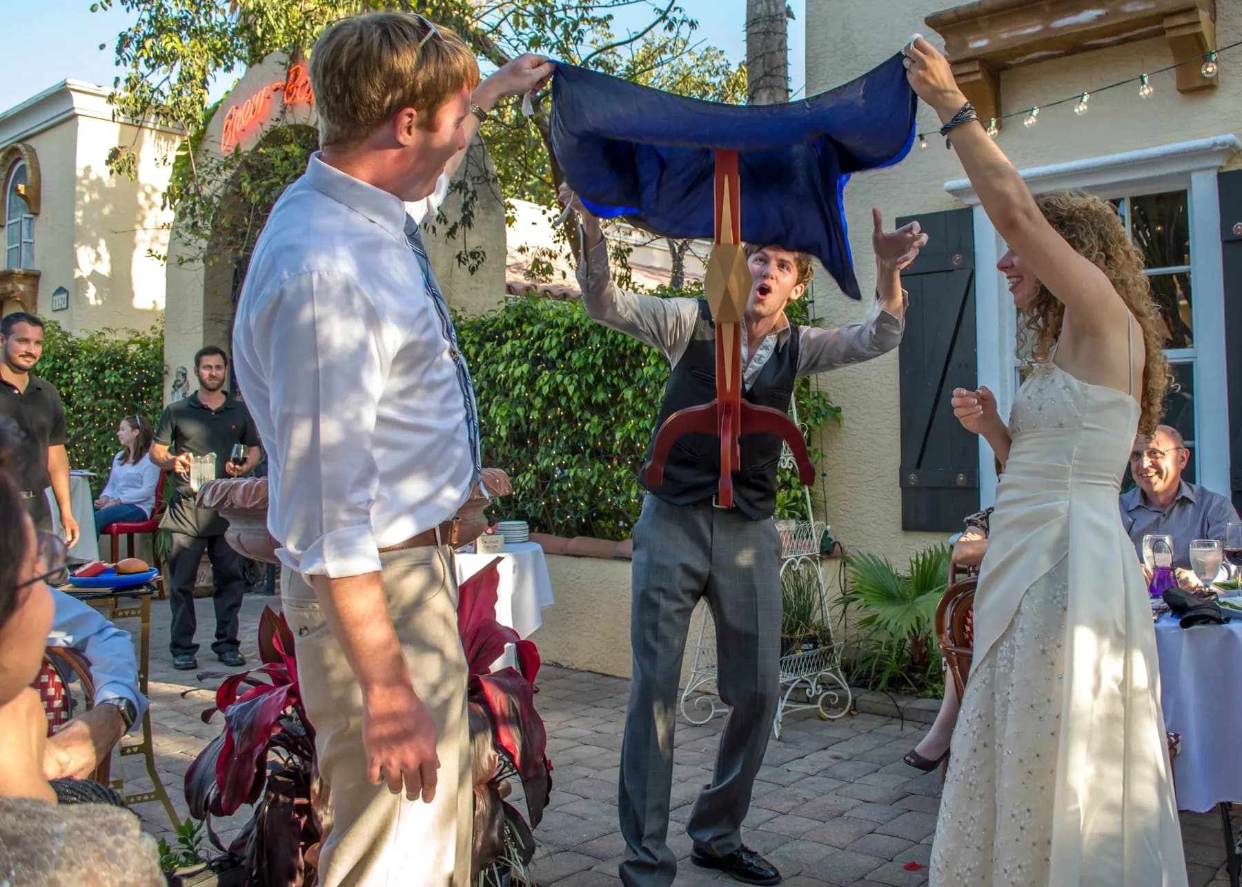 Stefan levitating a table outdoors as a crowd looks on