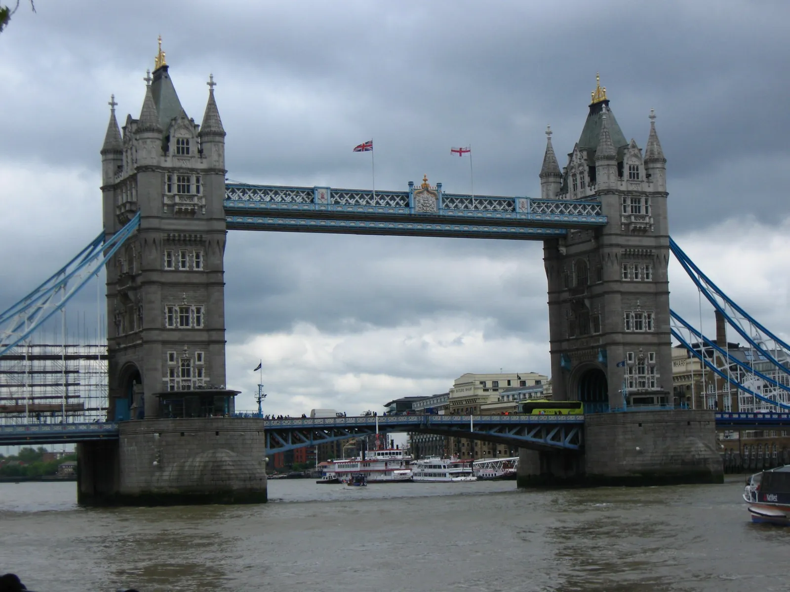 Tower Bridge over the River Thames under a cloudy sky