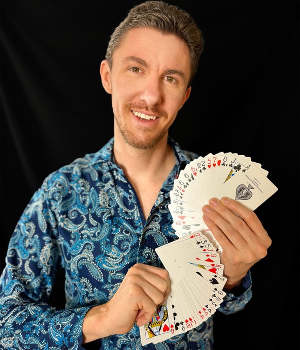 Stefan Oswald holding playing cards